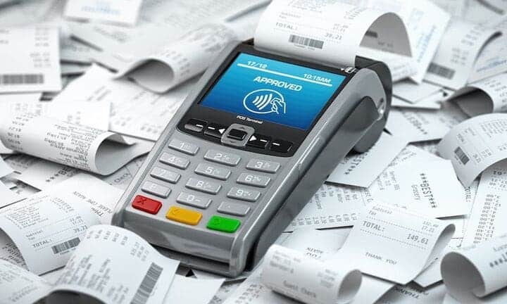 pos-terminal-in-a-heap-of-receipts-payment-for-a-2022-04-27-03-04-51-utc-1