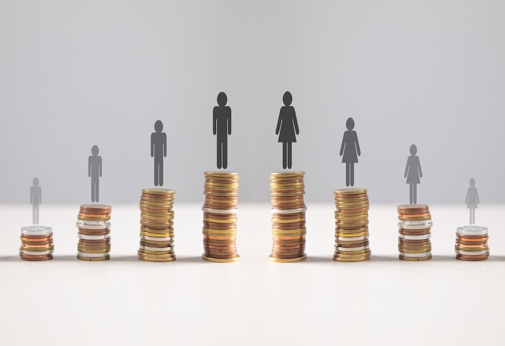 Coins with a Gender pay gap inequality concept.